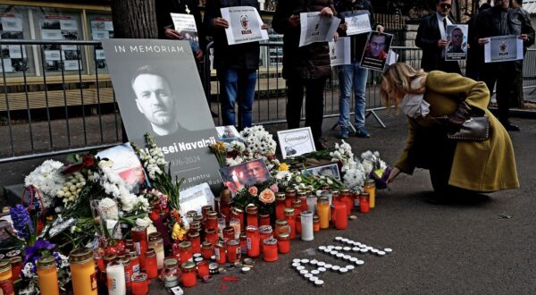 epa11163291 Burning candles and fresh flowers sit around portraits of late Russian opposition leader Alexei Navalny as people gather to pay their respects following his death, outside the Russian Embassy in Bucharest, Romania, 18 February 2024. Russian opposition leader and outspoken Kremlin critic Alexei Navalny has died aged 47 in a penal colony, the Federal Penitentiary Service of the Yamalo-Nenets Autonomous District announced on 16 February 2024. A prison service statement said that Navalny 'felt unwell' after a walk on 16 February, and it was investigating the causes of his death. In late 2023, Navalny was transferred to an Arctic penal colony considered one of the harshest prisons.  EPA/ROBERT GHEMENT