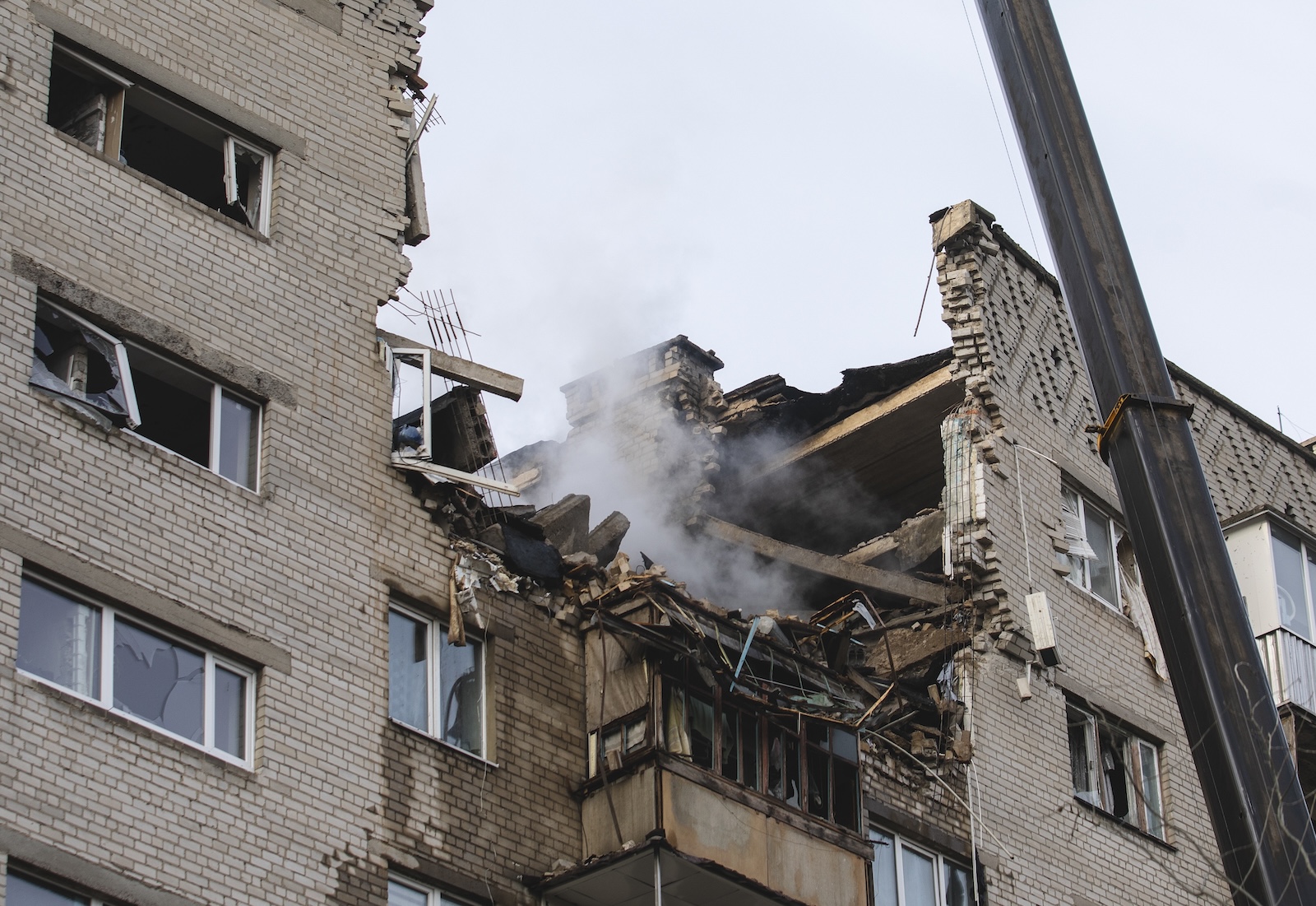 epa11174262 Rescuers work on the site of an overnight shock drone attack on a residential building in Dnipro, Dnipropetrovsk region, southeastern Ukraine, 23 February 2024, amid the Russian invasion. At least eight people were injured in Dnipro as Russia launched 31 shock drones on the south and central, 23 of them intercepted, according to the Ukrainian Air Force.  EPA/ARSEN DZODZAIEV