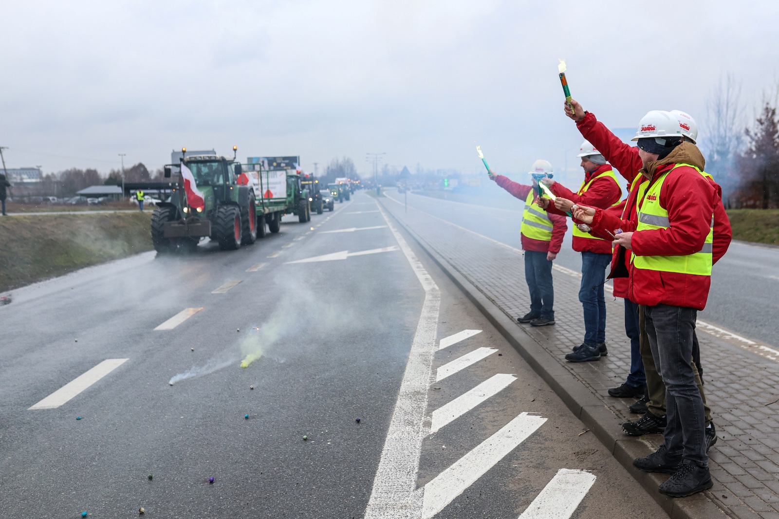 epa11175071 Farmers with their tractors protest on the access road to Katowice Airport, south Poland, 23 February 2024. Farmers from all over Poland are continuing their protests. Farmers from all over Poland are continuing their protests against the EU's agricultural policy, the Green Deal for Europe, excessive bureaucracy and unfair imports of cheaper products from Ukraine.  EPA/Michal Meissner  POLAND OUT