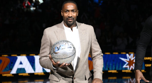 Former Washington Wizards player Gilbert Arenas takes part in a ceremony during the half-time of an NBA basketball game between the Wizards and the Miami Heat, Friday, Nov. 18, 2022, in Washington. (AP Photo/Nick Wass)