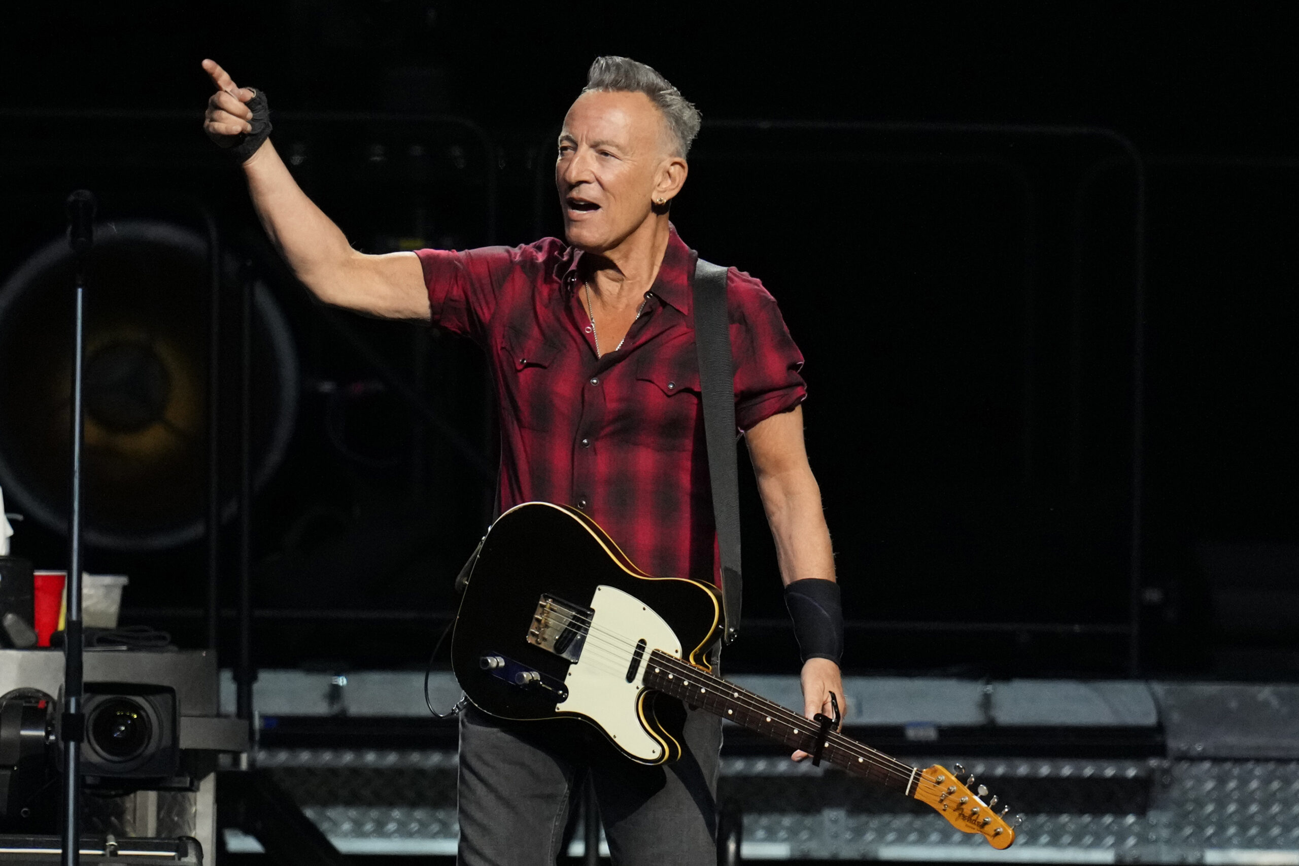 Bruce Springsteen shouts to the crowd on stage during his concert of Bruce Springsteen and The E Street Band World Tour 2024 performance Tuesday, March 19, 2024, in Phoenix. (AP Photo/Ross D. Franklin)