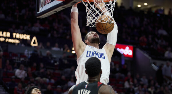 Los Angeles Clippers center Ivica Zubac dunks over Portland Trail Blazers center Deandre Ayton during the first half of an NBA basketball game in Portland, Ore., Wednesday, March 20, 2024. (AP Photo/Craig Mitchelldyer)