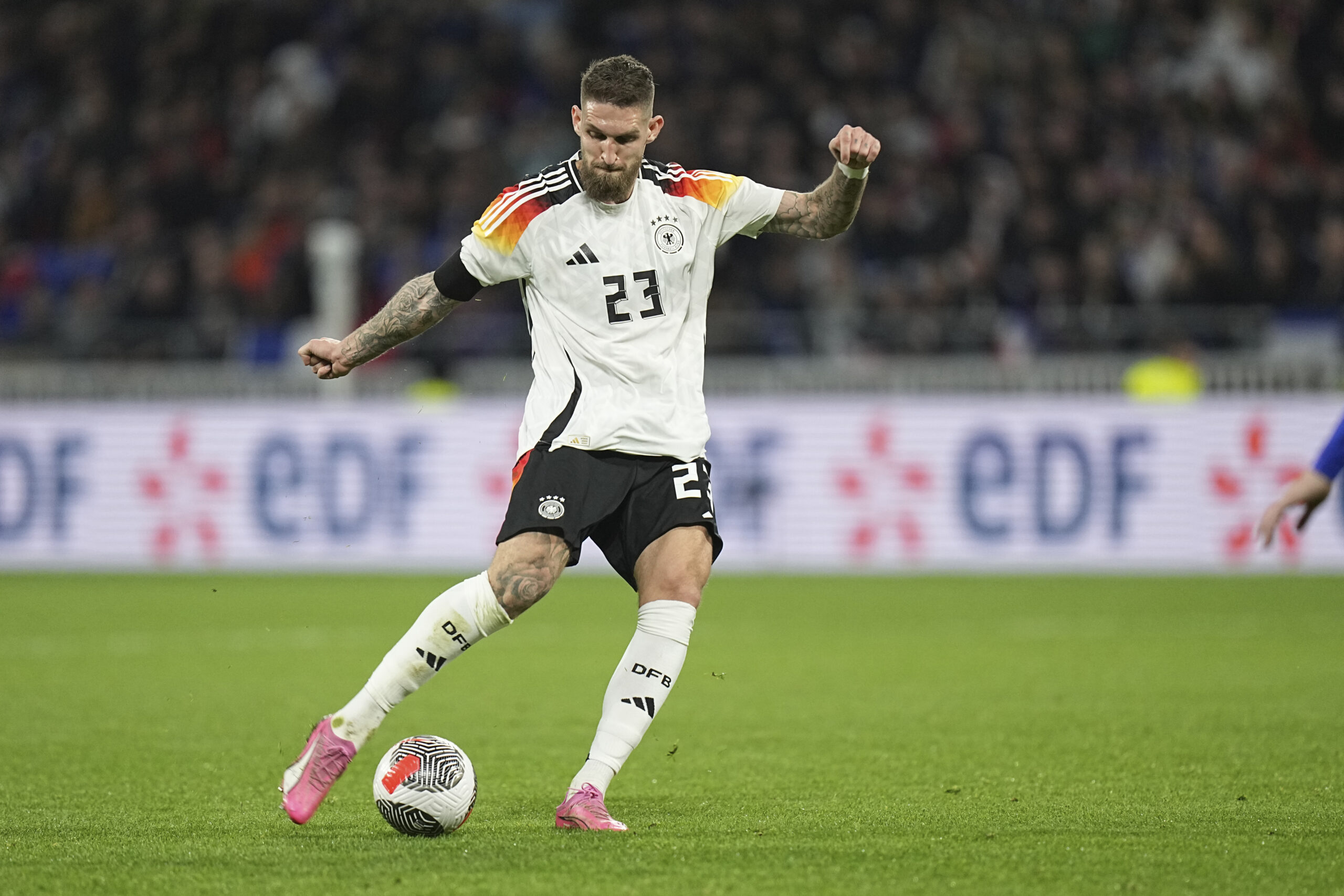 Germany's Robert Andrich in action during an international friendly soccer match between France and Germany at the Groupama stadium in Decines, near Lyon, central France, Saturday, March 23, 2024. (AP Photo/Laurent Cipriani)