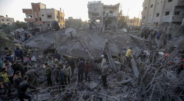 epa11168509 Palestinians search for bodies and survivors among the rubble following Israeli airstrikes on the west of Al Nusairat refugee camp, southern Gaza Strip, 20 February 2024. More than 29,000 Palestinians and at least 1,300 Israelis have been killed, according to the Palestinian Health Ministry and the Israel Defense Forces (IDF), since Hamas militants launched an attack against Israel from the Gaza Strip on 07 October, and the Israeli operations in Gaza and the West Bank which followed it.  EPA/MOHAMMED SABER