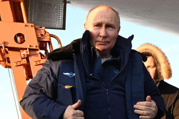 epa11172552 Russian President Vladimir Putin answers questions from journalists after a test flight aboard a Tupolev Tu-160 M strategic missile carrier during a visit to the Kazan Aviation Factory named after Sergei Gorbunov, a branch of the Tupolev military industry company, in Kazan, Republic of Tatarstan, Russia, 22 February 2024. Tu-160 (according to NATO codification - Blackjack) is a supersonic strategic missile carrier-bomber with variable sweep wings, developed at the Tupolev Design Bureau in the 1970-1980s. Although serial production of the Tu-160 was discontinued in the 1990s, works are underway in Russia to resume construction of the aircraft in a new look - Tu-160M.  EPA/DMITRIY AZAROV/SPUTNIK/KREMLIN POOL MANDATORY CREDIT