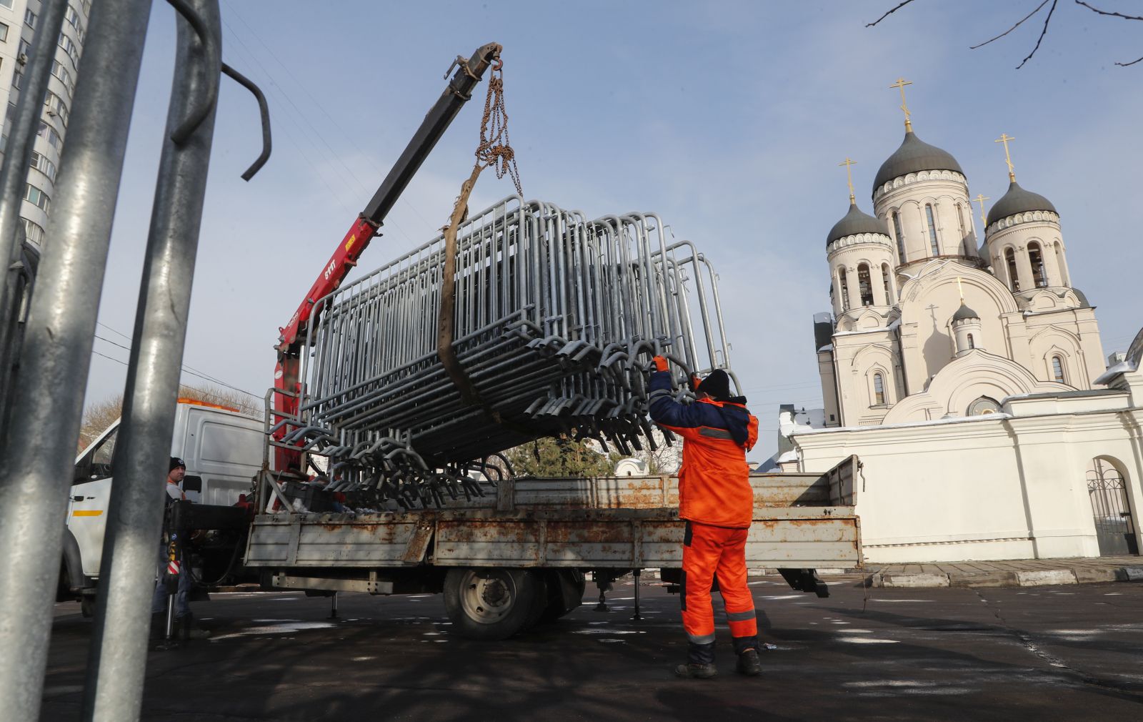 epa11188669 Municipal workers unload fences outside the Church of the Icon of the Mother of God, ahead of the upcoming funeral of late Russian opposition leader Alexei Navalny, in Moscow, Russia, 29 February 2024. Navalny’s funeral will be held at 14:00 local time on 01 March 2024, according to his press-secretary. Outspoken Kremlin critic Navalny died aged 47 in an arctic penal colony on 16 February 2024 after being transferred there in 2023. The colony is considered to be one of the world’s harshest prisons.  EPA/MAXIM SHIPENKOV