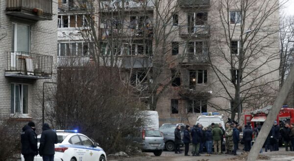 epa11192781 Russian emergency servicemen and investigators work near a damaged multi-storey residential building following an alleged drone attack in Saint Petersburg, Russia, 02 March 2024. Governor of Saint Petersburg, Alexander Beglov, wrote on his telegram channel that 'The emergency occurred in the Krasnogvardeisky district of St. Petersburg. As a result of the incident, residents of the affected apartments were evacuated'.  EPA/ANATOLY MALTSEV