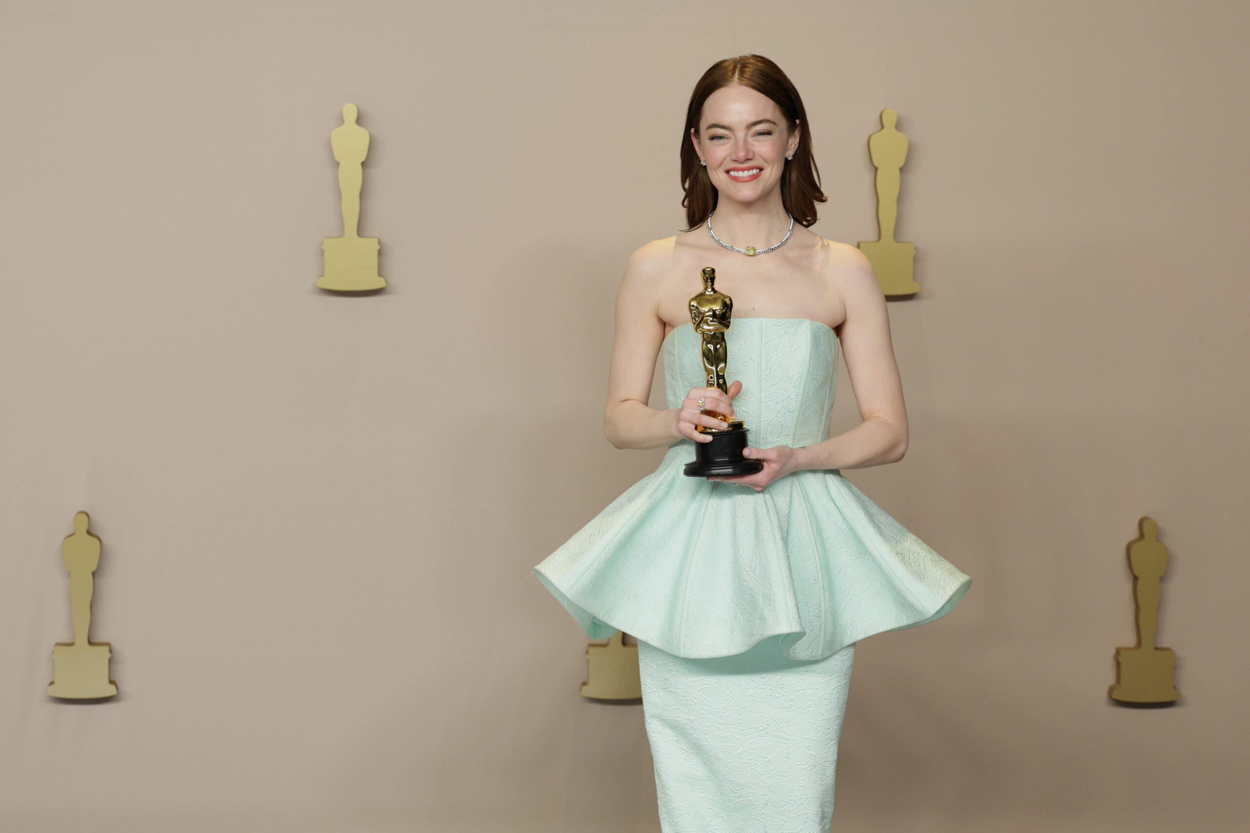 epa11213486 Emma Stone, winner of the Best Actress in a Leading Role award for 'Poor Things,' holds her Oscar in the press room during the 96th annual Academy Awards ceremony at the Dolby Theatre in the Hollywood neighborhood of Los Angeles, California, USA, 10 March 2024. The Oscars are presented for outstanding individual or collective efforts in filmmaking in 23 categories.  EPA/ALLISON DINNER