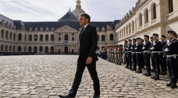 epa11231052 France's President Emmanuel Macron walks as he takes part in a 'national tribute' ceremony to late French politician and admiral, Philippe de Gaulle, the son of Charles de Gaulle, at the Hotel des Invalides in Paris, France, 20 March 2024. Admiral Philippe de Gaulle, the eldest child of General Charles de Gaulle, the first president of the French Fifth Republic, died on 13 March in Paris at the age of 102.  EPA/LUDOVIC MARIN / POOL  MAXPPP OUT