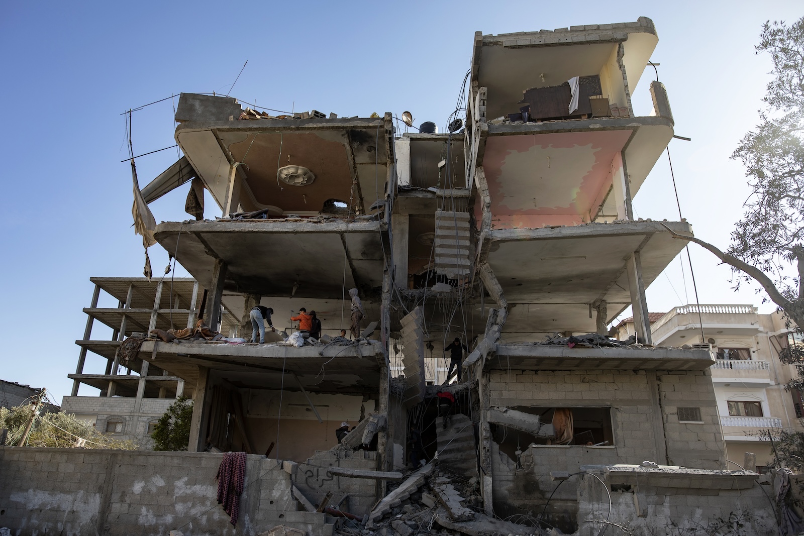 epa11242233 Palestinians, including members of Kurd and Barhoum families, inspect damages of their home after an Israeli airstrike targeted the Rafah refugee camp, southern Gaza Strip, 25 March 2024. More than 32,000 Palestinians and over 1,450 Israelis have been killed, according to the Palestinian Health Ministry and the Israel Defense Forces (IDF), since Hamas militants launched an attack against Israel from the Gaza Strip on 07 October 2023, and the Israeli operations in Gaza and the West Bank which followed it.  EPA/HAITHAM IMAD