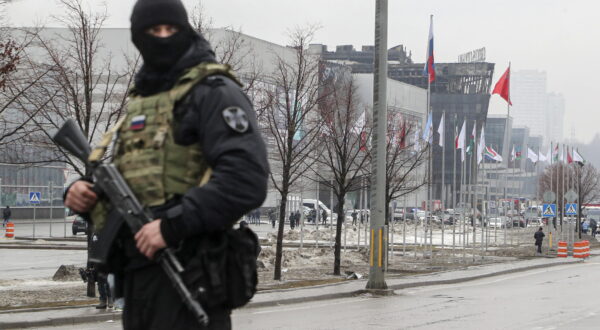 epa11238296 A Russian policeman guards near the burned Crocus City Hall concert venue following a terrorist attack in Krasnogorsk, outside Moscow, Russia, 23 March 2024. On 22 March evening, a group of up to five gunmen attacked the Crocus City Hall in the Moscow region, Russian emergency services said. 93 people were killed and more than 100 others were hospitalized, the Investigative Committee confirmed. The head of the Russian FSB, Alexander Bortnikov, reported to Russian President Vladimir Putin on 23 March on the arrest of 11 people, including all four terrorists directly involved in the terrorist attack.  EPA/MAXIM SHIPENKOV