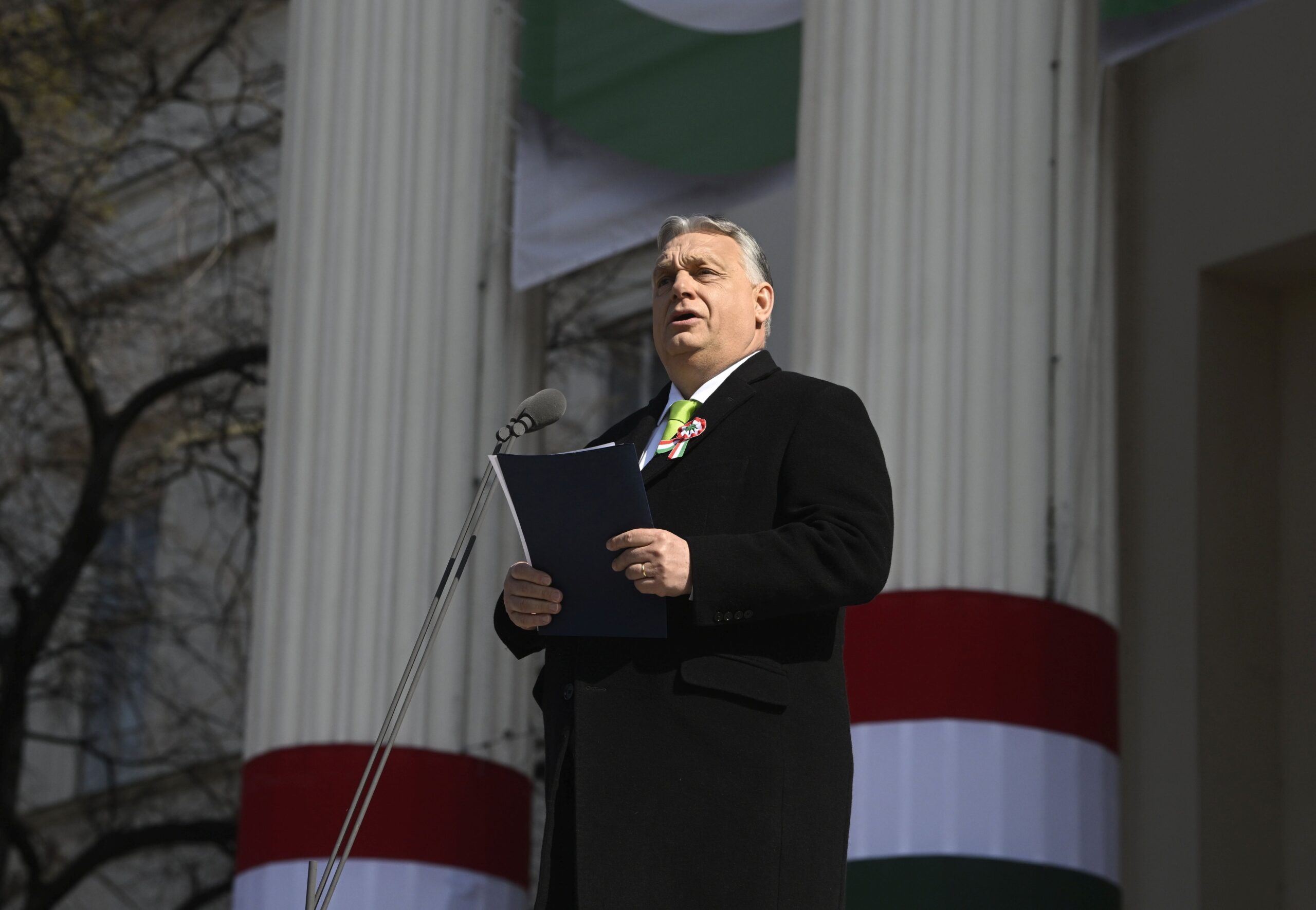 epa11221940 Hungarian Prime Minister Viktor Orban delivers his speech on the steps of the Hungarian National Museum during the official state ceremony to mark the 176th anniversary of the outbreak of the 1848 revolution and war of independence against Habsburg rule in Budapest, Hungary, 15 March 2024.  EPA/SZILARD KOSZTICSAK HUNGARY OUT