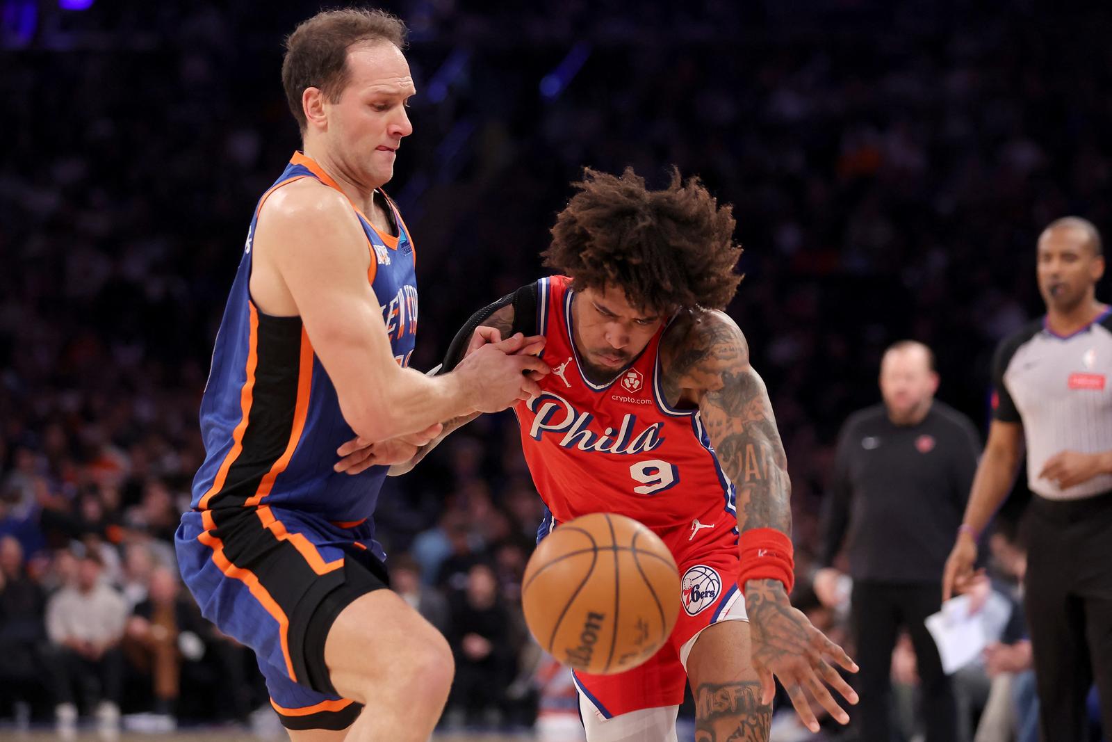 Mar 10, 2024; New York, New York, USA; Philadelphia 76ers guard Kelly Oubre Jr. (9) is fouled by New York Knicks forward Bojan Bogdanovic (44) during the second quarter at Madison Square Garden. Mandatory Credit: Brad Penner-USA TODAY Sports Photo: Brad Penner/REUTERS