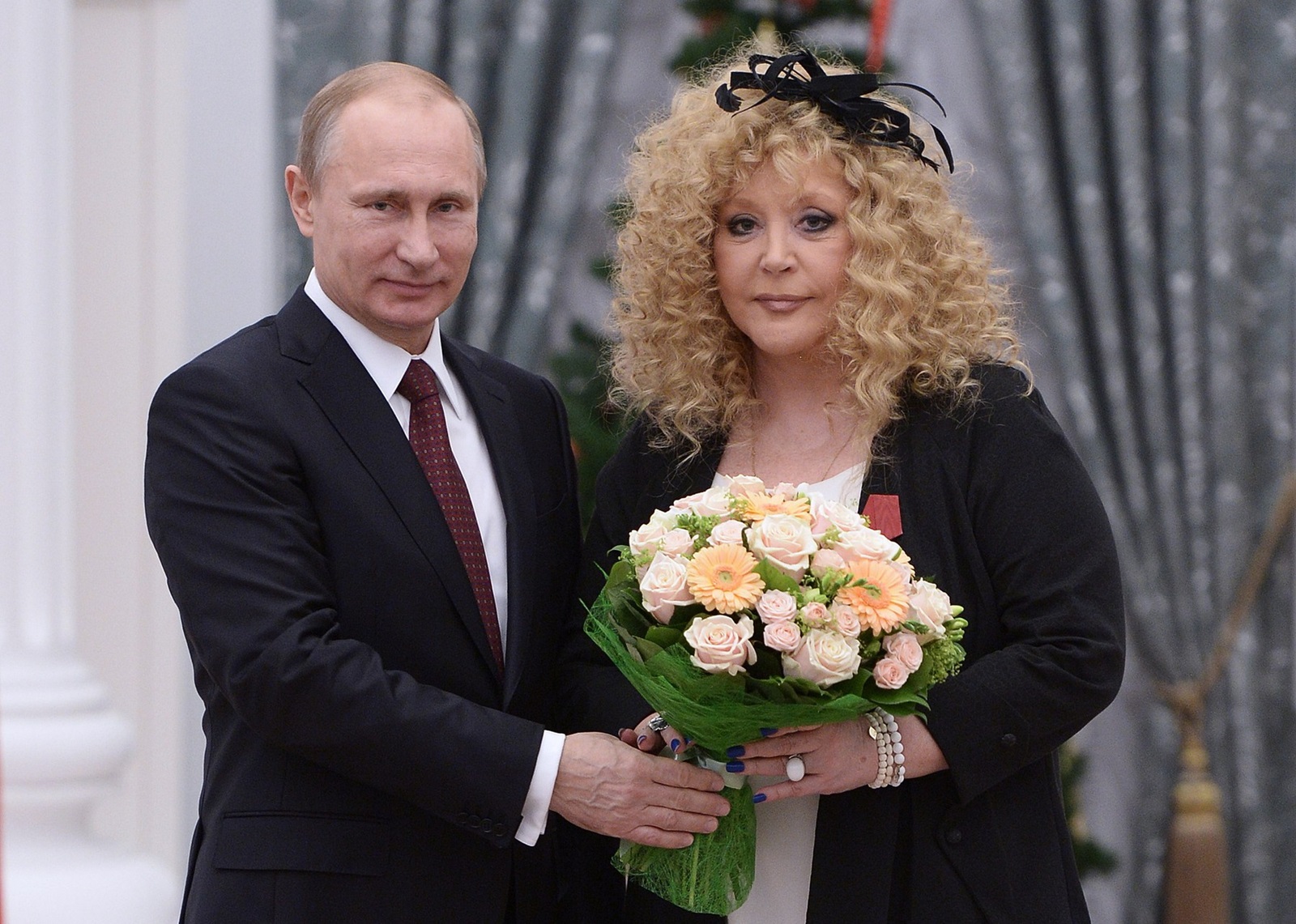 MOSCOW, RUSSIA. DECEMBER 22, 2014. Russian singer Alla Pugacheva receives an Order of Merit for the Fatherland (4th class) from Russia's president Vladimir Putin at a ceremony of presenting the state awards of the Russian Federation, at Moscow's Kremlin. Alexei Nikolsky/Russian presidential press service/TASS,Image: 213906539, License: Rights-managed, Restrictions: , Model Release: no, Credit line: Nikolsky Alexei / TASS / Profimedia