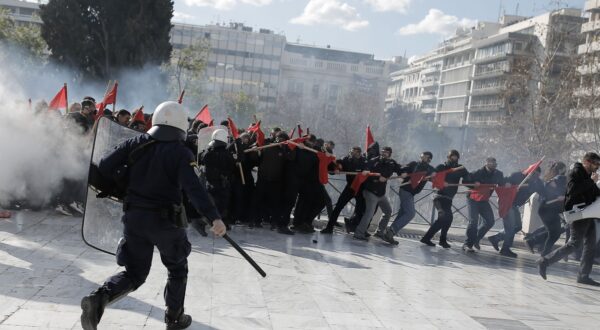 epa11206963 Riot police officers disperse a group of protesters during clashes following an education-sector protest rally in Athens, Greece, 08 March 2024. Greek students protest for the 9th consecutive week against a bill discussed in the Greek Parliament allowing the formation and operation of private universities in Greece. The debate on the bill is expected to be completed on 08 March by 8pm, to be followed by a roll call vote.  EPA/KOSTAS TSIRONIS