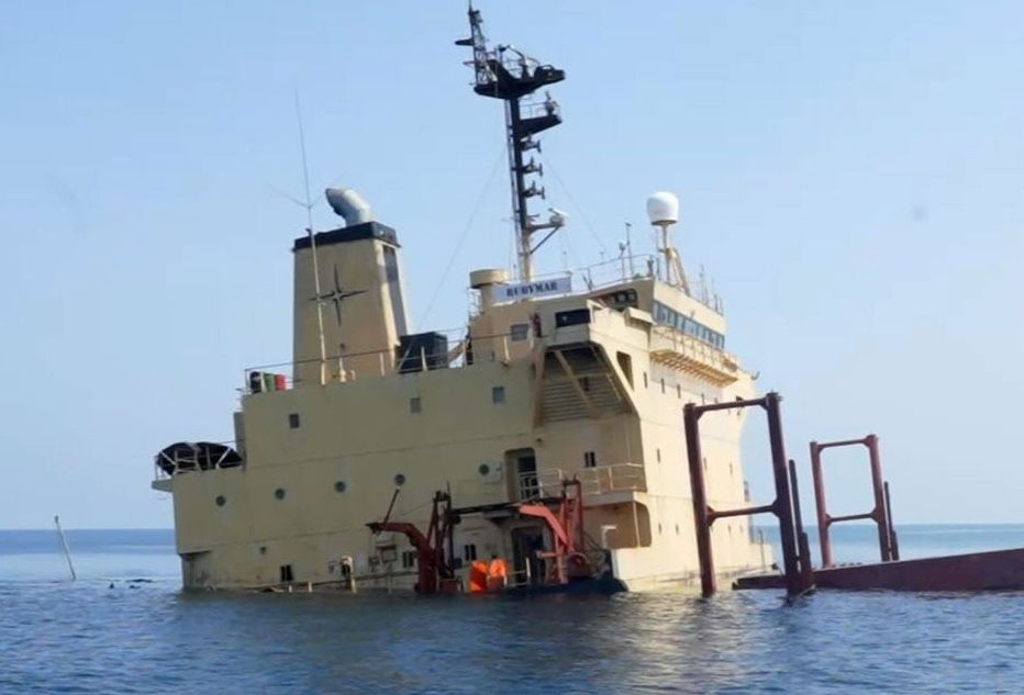 epa11184518 A handout photo made available by Yemeni Al-Joumhouriya TV shows the British-registered cargo vessel, Rubymar, sinking after being damaged in a missile attack by the Houthis in the Red Sea off the coast of Yemen, 26 February 2024 (issued 27 February 2024). The Saudi-backed government of Yemen has asked the United Nations for urgent help to avoid an environmental disaster due to the danger of a spill from Rubymar’s cargo of fertilizer, after it was hit a week ago in a missile strike by Yemen’s Houthis while sailing through the tense waters of the Red Sea. The US-led coalition continues to strike Houthi targets in Yemen as it seeks to degrade the Houthis' abilities to attack commercial shipping vessels amid high tensions in the Middle East. In light of increased maritime security threats, the US designation of the Houthis as a 'Specially Designated Global Terrorist Group' went into effect on 16 February.  EPA/Yemeni Al-Joumhouriya TV HANDOUT  HANDOUT EDITORIAL USE ONLY/NO SALES HANDOUT EDITORIAL USE ONLY/NO SALES