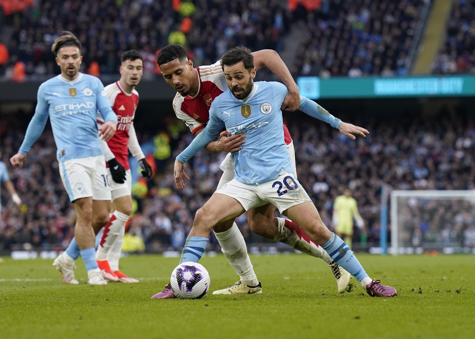 March 31, 2024, Manchester: Manchester, England, 31st March 2024. William Saliba of Arsenal grabs hold of Bernardo Silva of Manchester City during the Premier League match at the Etihad Stadium, Manchester.,Image: 861428033, License: Rights-managed, Restrictions: * United Kingdom Rights OUT *, Model Release: no, Credit line: Andrew Yates / Zuma Press / Profimedia