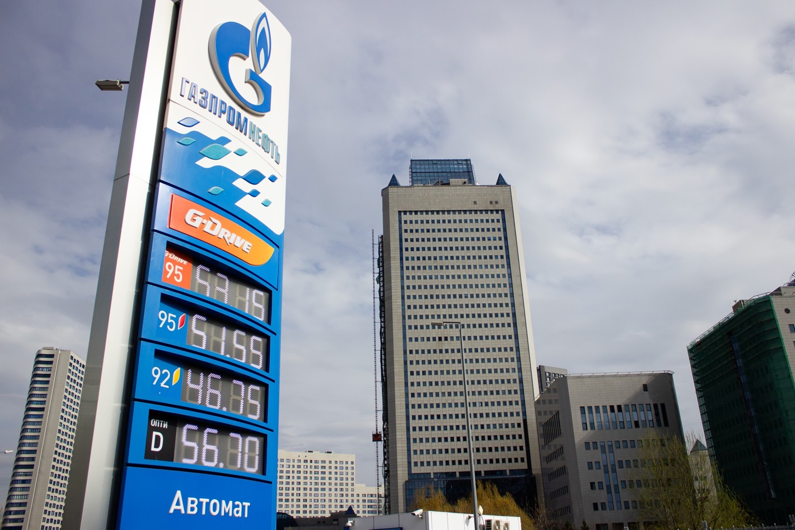 April 17, 2023, Moscow, Russia: A Gazprom Neft filling station is seen next to the Gazprom Headquarters building in Moscow. A subsidiary of Gazprom, Gazprom Neft is the third largest oil producer in Russia. According to Russian media reports, employees of Russian state oil and gas-producing corporations were informally prohibited from traveling abroad in December 2022. Recent reports indicate that rules on foreign travel for the above-mentioned employees were recently laxed to include 14 friendly countries including China, Turkey, India, Qatar, Serbia, Morocco, Sri Lanka, United Arab Emirates, and the CIS states.,Image: 770101350, License: Rights-managed, Restrictions: , Model Release: no, Credit line: Vlad Karkov / Zuma Press / Profimedia