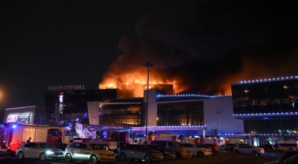 8647689 22.03.2024 Smoke rises above the Crocus City Hall concert venue following a reported shooting incident, near Moscow, Russia. Several gunmen in combat fatigues burst into a concert hall on March 22 and fired automatic weapons at the crowd, injuring an unspecified number of people.,Image: 858839271, License: Rights-managed, Restrictions: Editors' note: THIS IMAGE IS PROVIDED BY RUSSIAN STATE-OWNED AGENCY SPUTNIK., Model Release: no, Credit line: Maksim Blinov / Sputnik / Profimedia