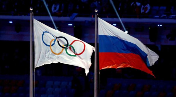 File photo dated 23-02-2014 of the Olympic flag next to the Russian flag. The International Olympic Committee has urged a boycott of Russia's planned 'Friendship Games', labelling the event a "cynical attempt" by the country to "politicise sport". Issue date: Tuesday March 19, 2024.,Image: 858062672, License: Rights-managed, Restrictions: FILE PHOTO RESTRICTIONS: For news services only. Editorial purposes only. No video emulation. For news services only. Editorial purposes only. No video emulation., Model Release: no, Credit line: David Davies / PA Images / Profimedia