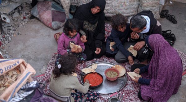 Members of the Rabaya family break their fast amidst the rubble of their home, which was destroyed by an Israeli strike, during the Muslim holy month of Ramadan in Rafah on March 23, 2024, amid ongoing battles between Israel and the militant group Hamas.,Image: 859035942, License: Rights-managed, Restrictions: , Model Release: no, Credit line: SAID KHATIB / AFP / Profimedia