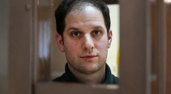 US journalist Evan Gershkovich, arrested on espionage charges, looks out from inside a defendants' cage before a hearing to consider an appeal on his extended pre-trial detention, at the Moscow City Court in Moscow on February 20, 2024. Wall Street Journal reporter Evan Gershkovich was detained last March on spying charges during a reporting trip to the Urals.,Image: 848592713, License: Rights-managed, Restrictions: , Model Release: no, Credit line: NATALIA KOLESNIKOVA / AFP / Profimedia