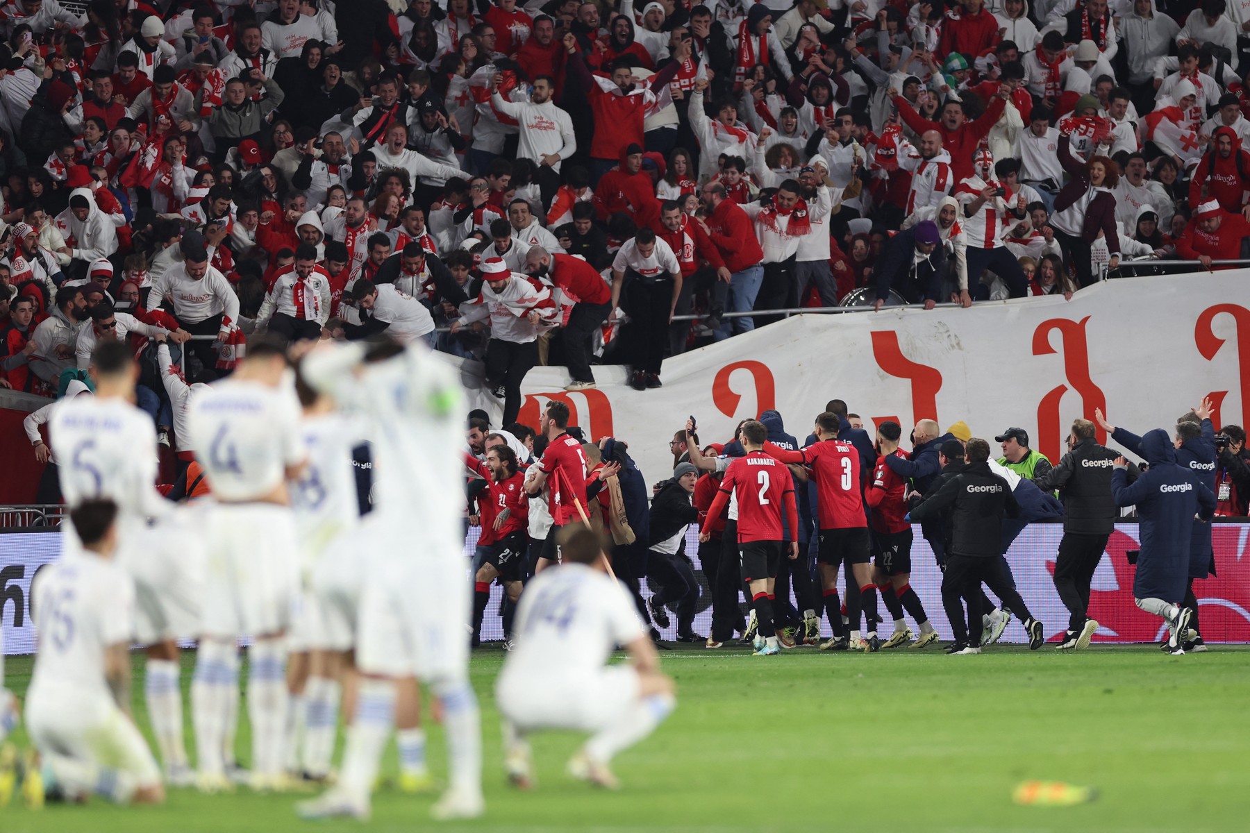Georgia's players celebrate winning the UEFA EURO 2024 qualifying play-off final football match between Georgia and Greece in Tbilisi on March 26, 2024.,Image: 859815039, License: Rights-managed, Restrictions: , Model Release: no, Credit line: Giorgi ARJEVANIDZE / AFP / Profimedia