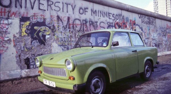 Germany - March 6, 2024.The Trabant GDR cult car turns 60..Germany, Berlin - 1990  .TRABANT car  next to the Wall,Image: 854292283, License: Rights-managed, Restrictions: * France, Germany and Italy Rights Out *, Model Release: no, Credit line: Antonio Pisacreta / Zuma Press / Profimedia
