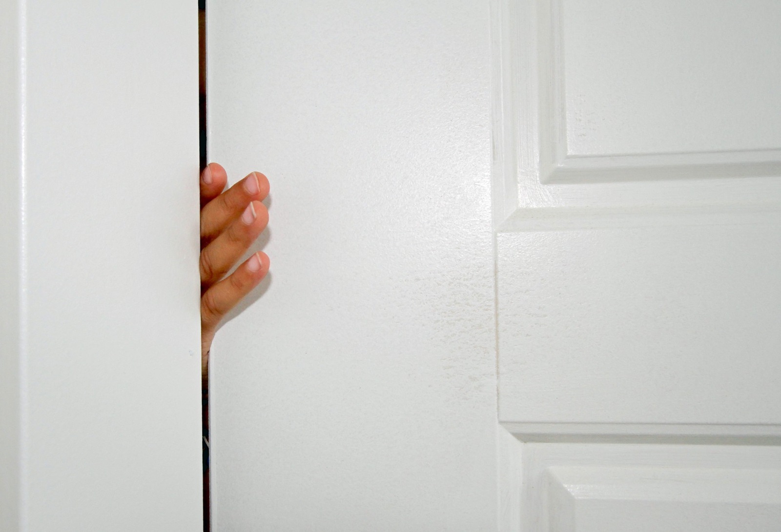 Small fingers stuck in white door inside of house,Image: 557350207, License: Royalty-free, Restrictions: , Model Release: no, Credit line: Nadine Mitchell / Panthermedia / Profimedia
