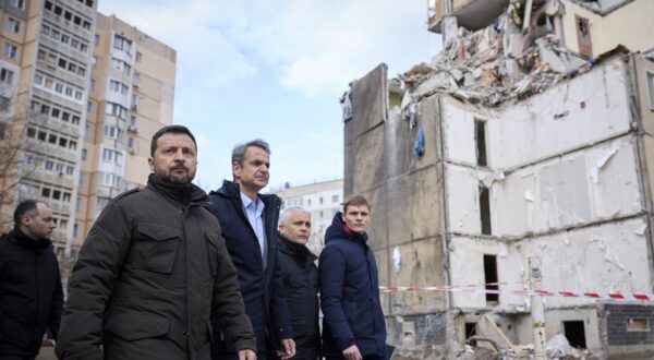 epa11202343 A handout photo made available by the presidential press service shows Ukrainian President Volodymyr Zelensky (L) and Greek Prime Minister Kyriakos Mitsotakis (2-L) walking in front of a damaged residential building at a site hit in a Russian drone attack on 02 March 2024, in Odesa, Ukraine, 06 March 2024. Twelve people died, including five children, and eight others were injured in the drone attack. The Greek prime minister arrived in Odesa to meet with top Ukrainian officials amid the Russian invasion.  EPA/PRESIDENTIAL PRESS SERVICE HANDOUT   HANDOUT EDITORIAL USE ONLY/NO SALES HANDOUT EDITORIAL USE ONLY/NO SALES