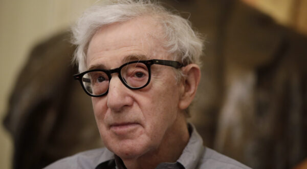 FILE - In this Tuesday, July 2, 2019 file photo, director Woody Allen attends a press conference at La Scala opera house, in Milan, Italy. The filmmaker had sued Amazon in February after the online giant ended his contract without ever releasing a completed film, "A Rainy Day in New York." Amazon had responded that Allen, whose daughter Dylan has accused him of molesting her, breached the deal by making insensitive remarks about the #MeToo movement. In papers filed Friday, Nov. 8, 2019, in U.S. District Court, Allen and Amazon agreed that the case should be dismissed without prejudice. (AP Photo/Luca Bruno)