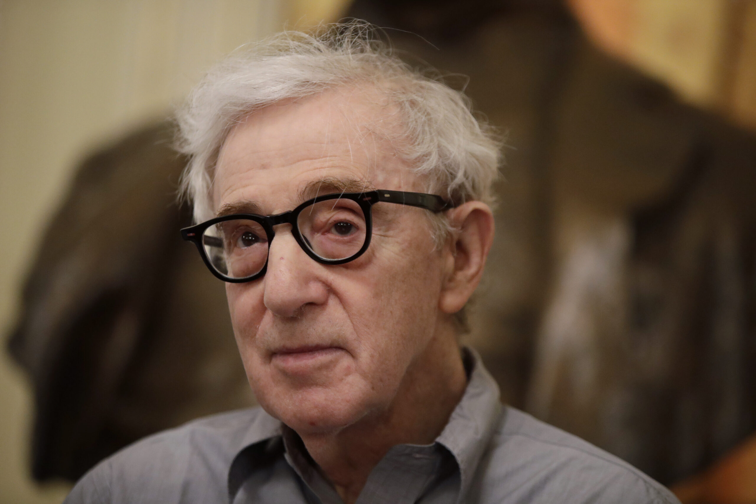 FILE - In this Tuesday, July 2, 2019 file photo, director Woody Allen attends a press conference at La Scala opera house, in Milan, Italy. The filmmaker had sued Amazon in February after the online giant ended his contract without ever releasing a completed film, "A Rainy Day in New York." Amazon had responded that Allen, whose daughter Dylan has accused him of molesting her, breached the deal by making insensitive remarks about the #MeToo movement. In papers filed Friday, Nov. 8, 2019, in U.S. District Court, Allen and Amazon agreed that the case should be dismissed without prejudice. (AP Photo/Luca Bruno)