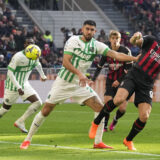 AC Milan's Olivier Giroud, right, and Sassuolo's Martin Erlic vie for the ball during a Serie A soccer match between AC Milan and Sassuolo at the San Siro stadium in Milan, Italy, Sunday, Jan. 29, 2023. (AP Photo/Antonio Calanni)