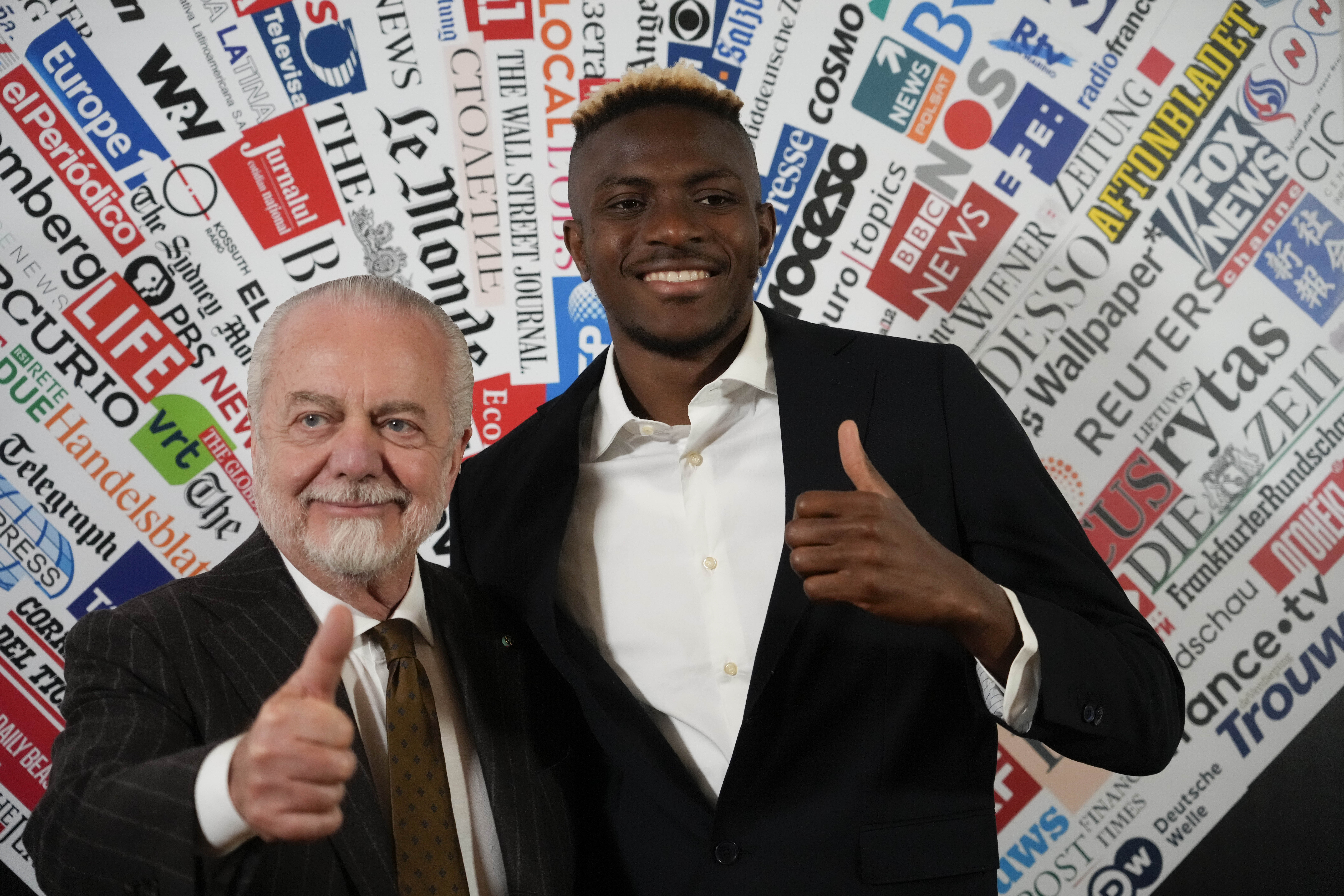 SS Napoli striker Victor Osimhen, right, poses with team President Aurelio De Laurentiis, prior to being awarded the "Best Foreign Athlete of the Year" by the Foreign Press Club in Rome, Monday, March 6, 2023. (AP Photo/Gregorio Borgia)