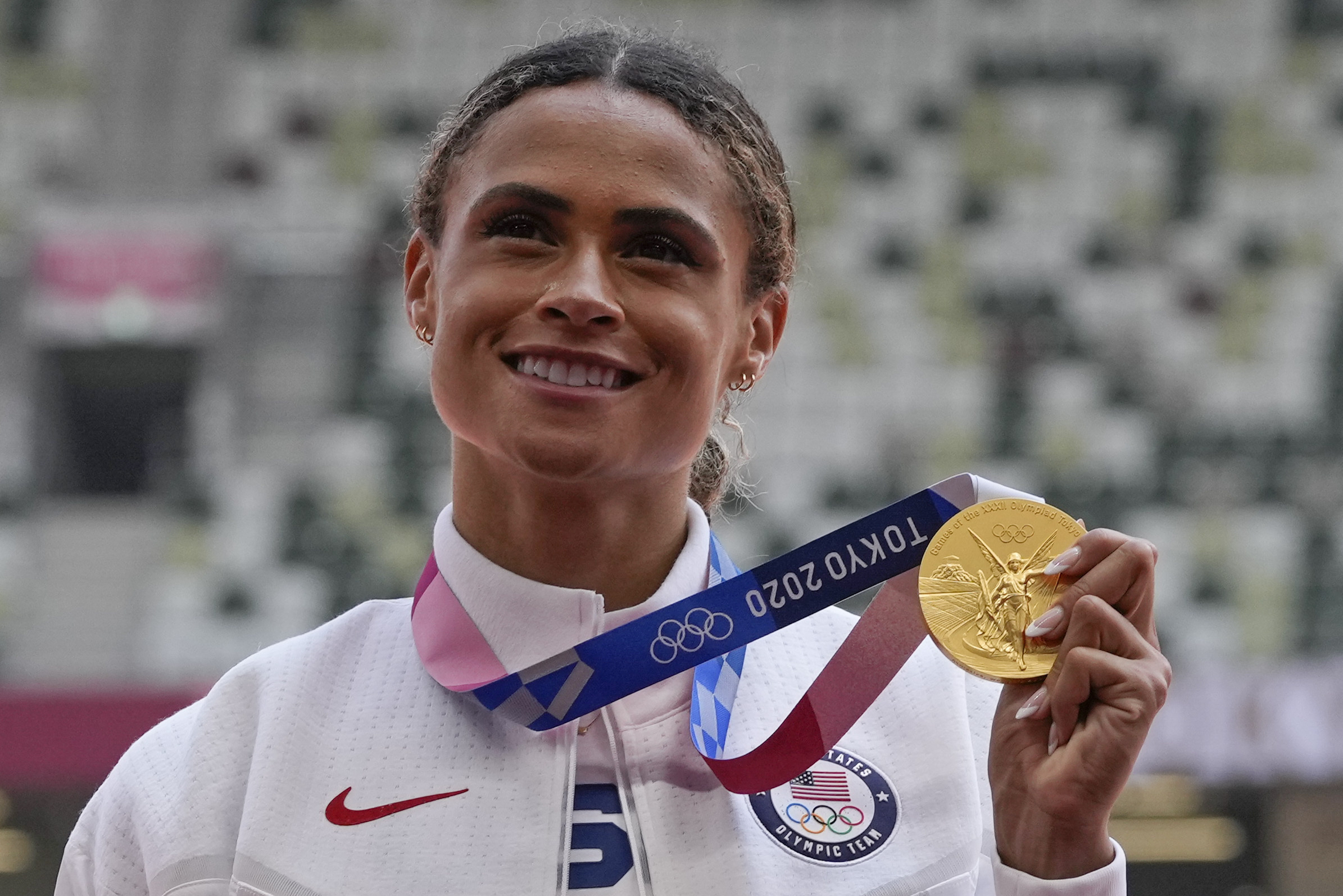 FILE - Gold medalist Sydney McLaughlin, of the United States, poses during the medal ceremony for the women's 400-meter hurdles at the 2020 Summer Olympics, Wednesday, Aug. 4, 2021, in Tokyo. (AP Photo/Francisco Seco, File)