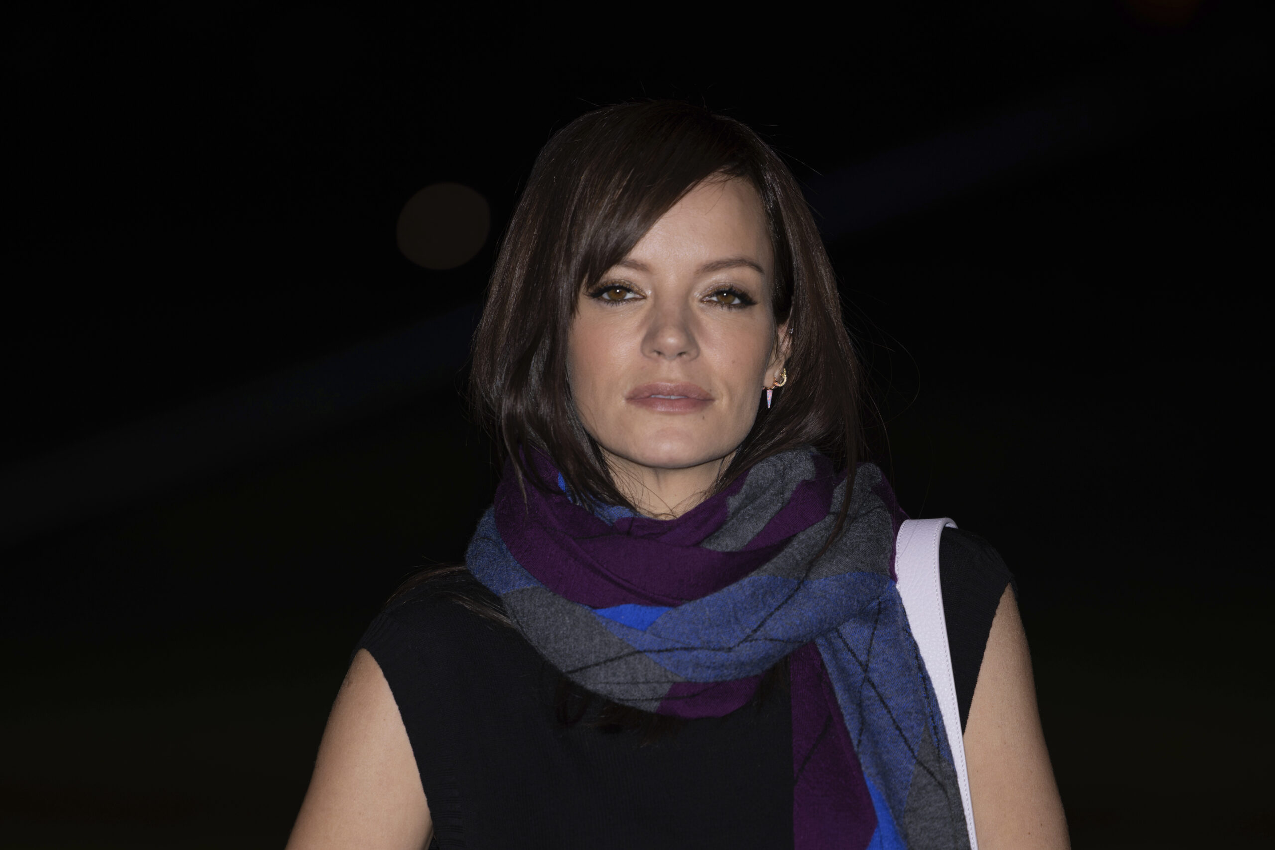 Lily Allen poses for photographers upon arrival at the Burberry Winter 2024 fashion show on Monday, Feb. 19, 2024 in London. (Photo by Vianney Le Caer/Invision/AP)