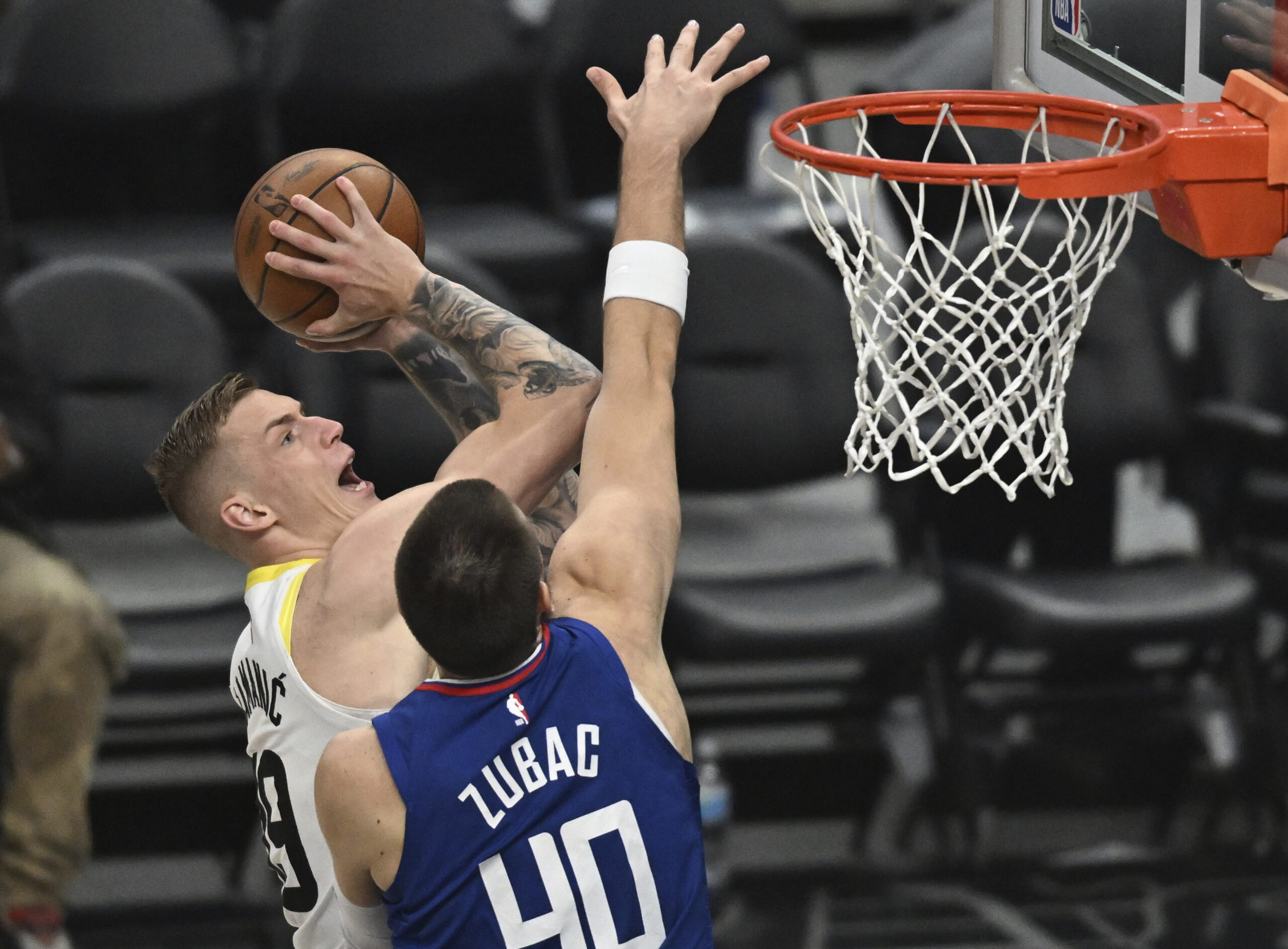 LOS ANGELES, CA - APRIL 12: Utah Jazz Forward Luka Samanic (19) shoots over Los Angeles Clippers Center Ivica Zubac (40) during a regular season NBA Basketball game at Crypto.com Arena. (Photo by John McCoy/Icon Sportswire) (Icon Sportswire via AP Images)