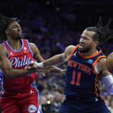 New York Knicks' Jalen Brunson, right, tries to get past Philadelphia 76ers' Tyrese Maxey during the first half of Game 4 in an NBA basketball first-round playoff series, Sunday, April 28, 2024, in Philadelphia. (AP Photo/Matt Slocum)
