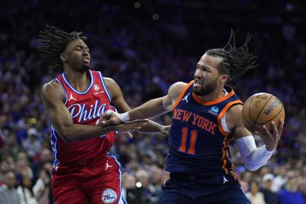 New York Knicks' Jalen Brunson, right, tries to get past Philadelphia 76ers' Tyrese Maxey during the first half of Game 4 in an NBA basketball first-round playoff series, Sunday, April 28, 2024, in Philadelphia. (AP Photo/Matt Slocum)