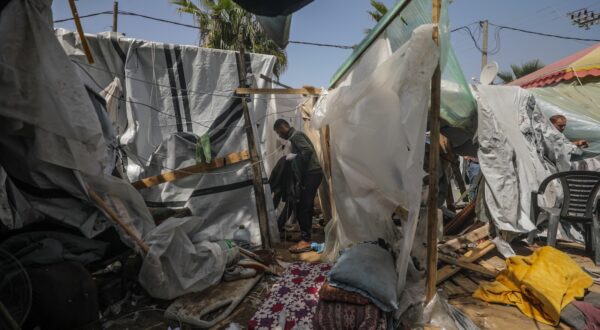 epa11252942 Palestinians inspect destroyed shelter tents following an Israeli air strike near Al Aqsa hospital, in Deir Al Balah town in southern Gaza Strip, 31 March 2024. Three Palestinian journalists were wounded and two displaced persons were killed in the air strike, according to Palestinian Civilian Defence. More than 32,700 Palestinians and over 1,450 Israelis have been killed, according to the Palestinian Health Ministry and the Israel Defense Forces (IDF), since Hamas militants launched an attack against Israel from the Gaza Strip on 07 October 2023, and the Israeli operations in Gaza and the West Bank which followed it.  EPA/MOHAMMED SABER