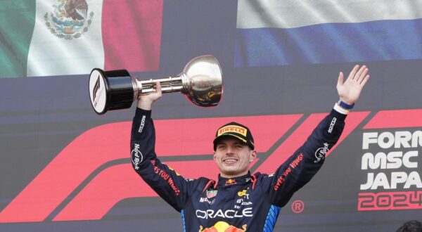 epa11263562 First place Red Bull Racing driver Max Verstappen of the Netherlands celebrates with his trophy on the podium after the Formula One Japanese Grand Prix at the Suzuka International Racing Course in Suzuka, Japan, 07 April 2024.  EPA/FRANCK ROBICHON