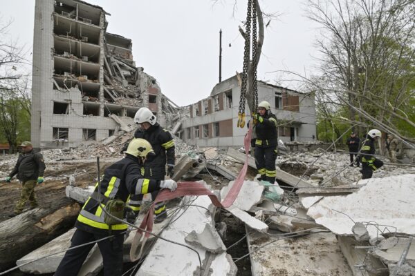 epa11284581 Ukrainian rescuers work at the site of a missile strike in Chernihiv, northern Ukraine, 17 April 2024, amid the Russian invasion. At least 17 people were killed and 60 others injured, including three children, following a Russian missile strike in Chernihiv, the State Emergency Service of Ukraine (SESU) said, adding that a search and rescue operation was ongoing. A social infrastructure facility, a hospital, and several residential high-rise buildings were damaged as a result of the morning rocket attack in Chernihiv, north of Kyiv, Ukrainian officials said.  EPA/SERHII OLEXANDROV