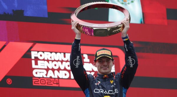 epa11291206 Red Bull Racing driver Max Verstappen of the Netherlands celebrates with his trophy after winning the Formula One Chinese Grand Prix, in Shanghai, China, 21 April 2024. The 2024 Formula 1 Chinese Grand Prix is held at the Shanghai International Circuit racetrack on 21 April after a five-year hiatus.  EPA/ALEX PLAVEVSKI