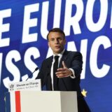 epa11299565 French President Emmanuel Macron delivers a speech on Europe next to a slogan reading 'A powerful Europe' in the amphitheater of the Sorbonne University in Paris, France, 25 April 2024. Macron is to speak about the future of the European Union nearly seven years after his previous speech and ahead of the European elections on 09 June.  EPA/CHRISTOPHE PETIT TESSON / POOL