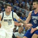 Apr 21, 2024; Los Angeles, California, USA; Dallas Mavericks guard Luka Doncic (77) is defended by Los Angeles Clippers center Ivica Zubac (40) in the second half of game one of the first round for the 2024 NBA playoffs at Crypto.com Arena. Mandatory Credit: Jayne Kamin-Oncea-USA TODAY Sports Photo: Jayne Kamin-Oncea/REUTERS