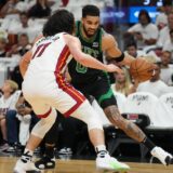 Apr 27, 2024; Miami, Florida, USA; Boston Celtics forward Jayson Tatum (0) drives to the baseline as Miami Heat guard Jaime Jaquez Jr. (11) defends in the first half during game three of the first round for the 2024 NBA playoffs at Kaseya Center. Mandatory Credit: Jim Rassol-USA TODAY Sports Photo: Jim Rassol/REUTERS