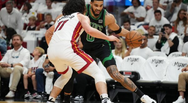 Apr 27, 2024; Miami, Florida, USA; Boston Celtics forward Jayson Tatum (0) drives to the baseline as Miami Heat guard Jaime Jaquez Jr. (11) defends in the first half during game three of the first round for the 2024 NBA playoffs at Kaseya Center. Mandatory Credit: Jim Rassol-USA TODAY Sports Photo: Jim Rassol/REUTERS