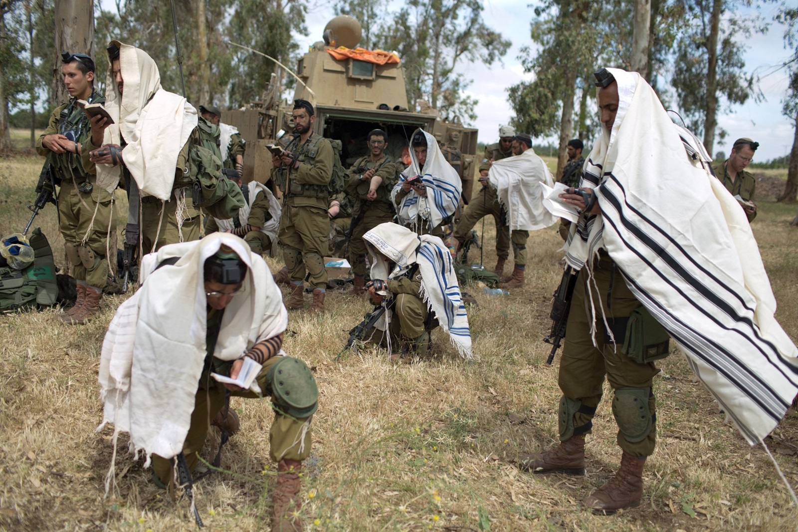 Israeli soldiers of the Jewish Ultra-Orthodox battalion "Netzah Yehuda" hold morning prayers as they take part in their annual unit training in the Israeli annexed Golan Heights, near the Syrian border on May 19, 2014. The Netzah Yehuda Battalion is a battalion in the Kfir Brigade of the Israel military which was created  to allow religious Israelis to serve in the army  in an atmosphere respecting their religious convictions.,Image: 194044789, License: Rights-managed, Restrictions: , Model Release: no, Credit line: MENAHEM KAHANA / AFP / Profimedia