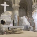 This video grab created from an AFP video taken on April 11, 2024, shows a worker restoring a balustrade inside Paris Notre-Dame cathedral under restoration since the devastating fire that ravaged it on April 15, 2019. A tender for the creation of contemporary stained-glass windows was launched on April 11, 2024. The iconic Parisian monument is scheduled to reopen in December 2024.,Image: 864058228, License: Rights-managed, Restrictions: , Model Release: no, Credit line: Mathilde BELLENGER / AFP / Profimedia