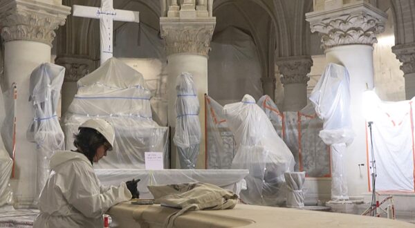 This video grab created from an AFP video taken on April 11, 2024, shows a worker restoring a balustrade inside Paris Notre-Dame cathedral under restoration since the devastating fire that ravaged it on April 15, 2019. A tender for the creation of contemporary stained-glass windows was launched on April 11, 2024. The iconic Parisian monument is scheduled to reopen in December 2024.,Image: 864058228, License: Rights-managed, Restrictions: , Model Release: no, Credit line: Mathilde BELLENGER / AFP / Profimedia